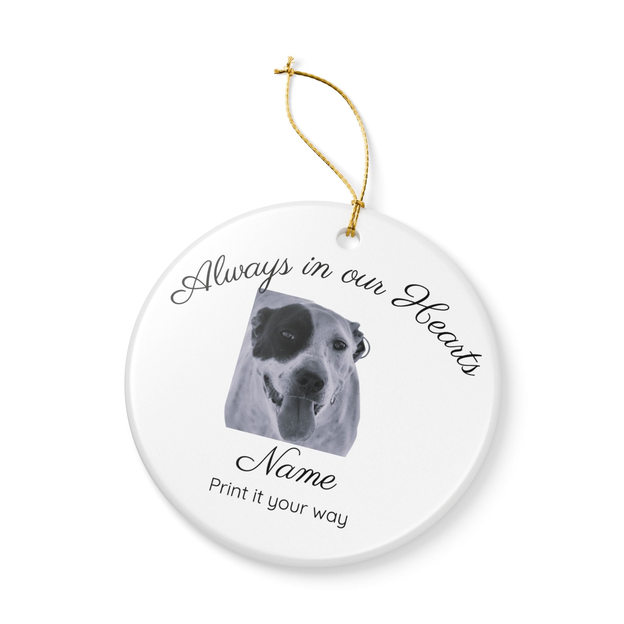 Pet photo memorial ornament displayed on holiday wreath with soft bokeh background
