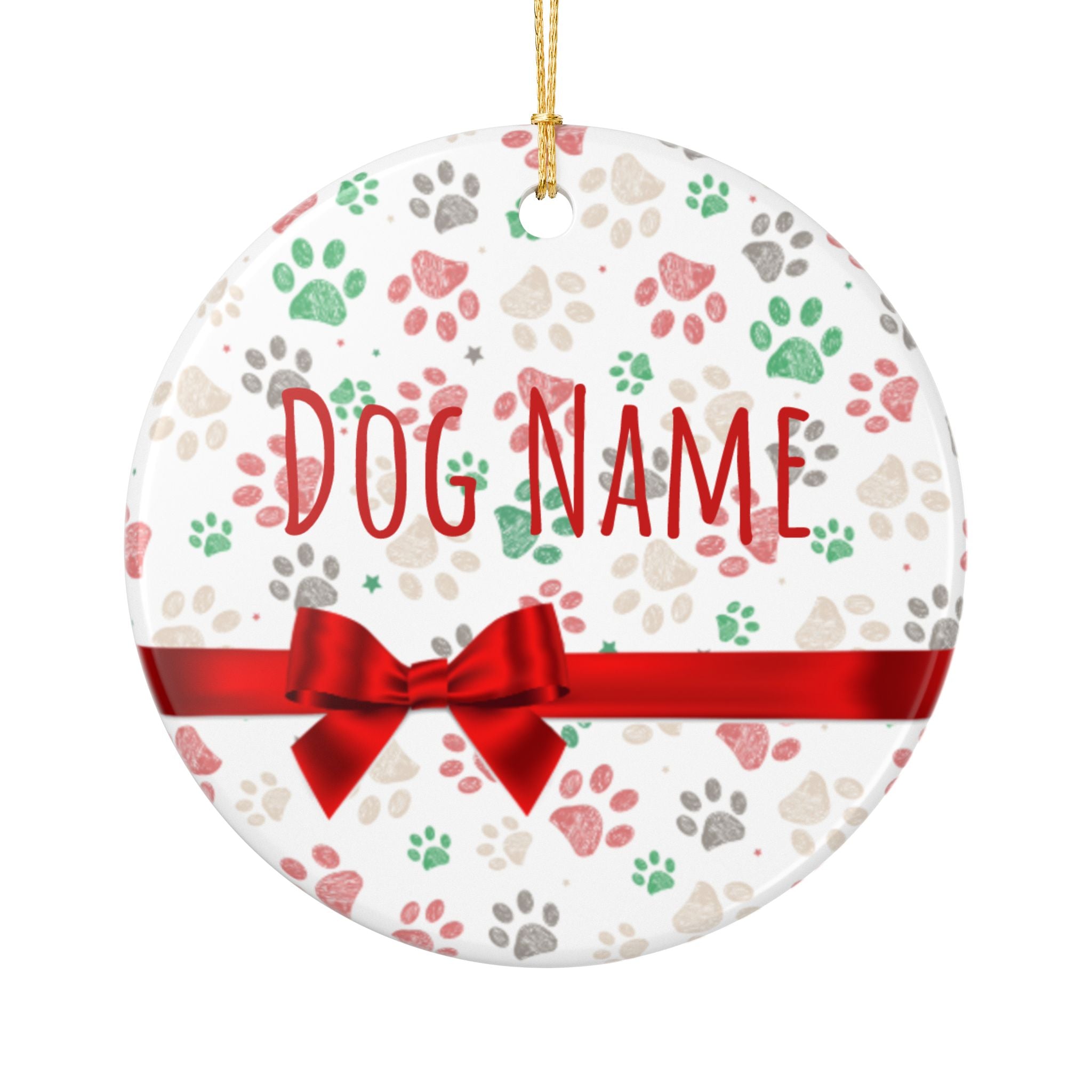Personalized paw print Christmas ornament held in hand showing name and design
