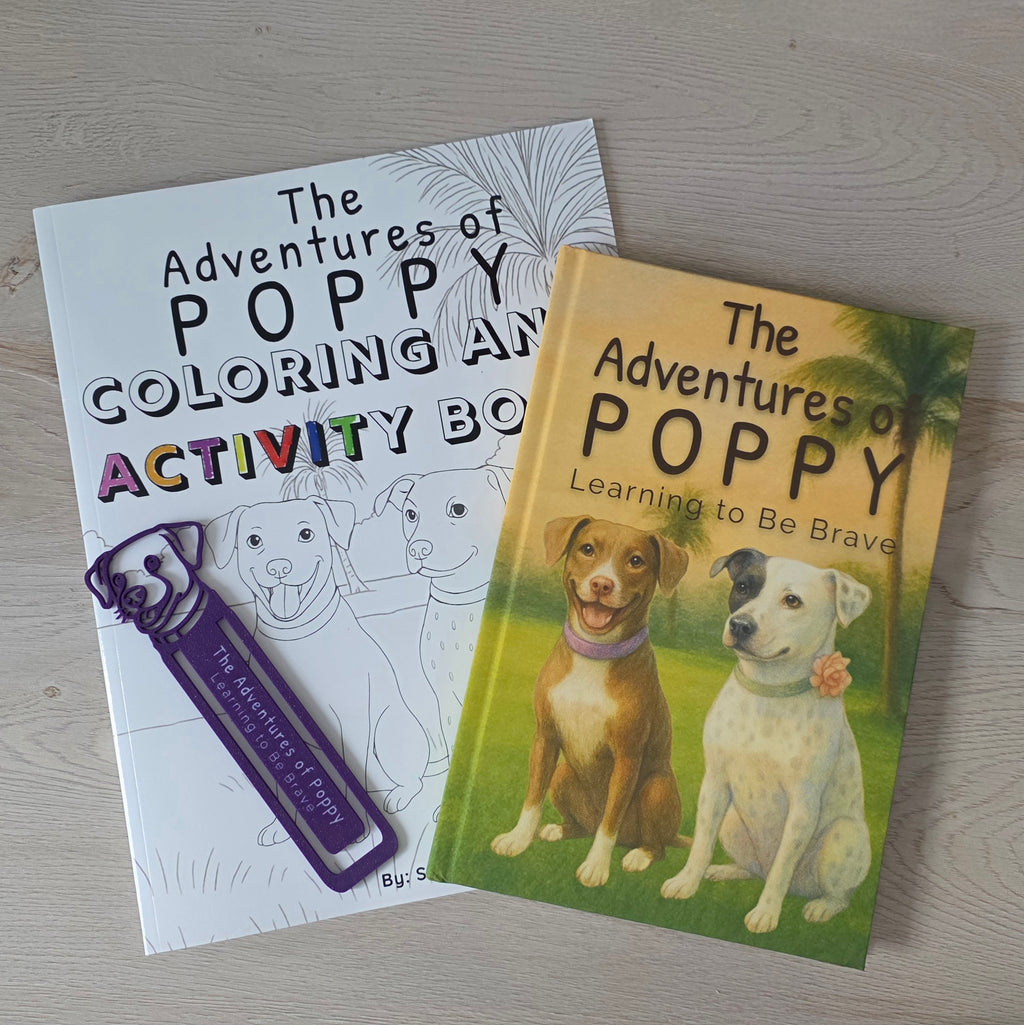 Two books titled 'The Adventures of Poppy' on a wooden surface with bookmark. 