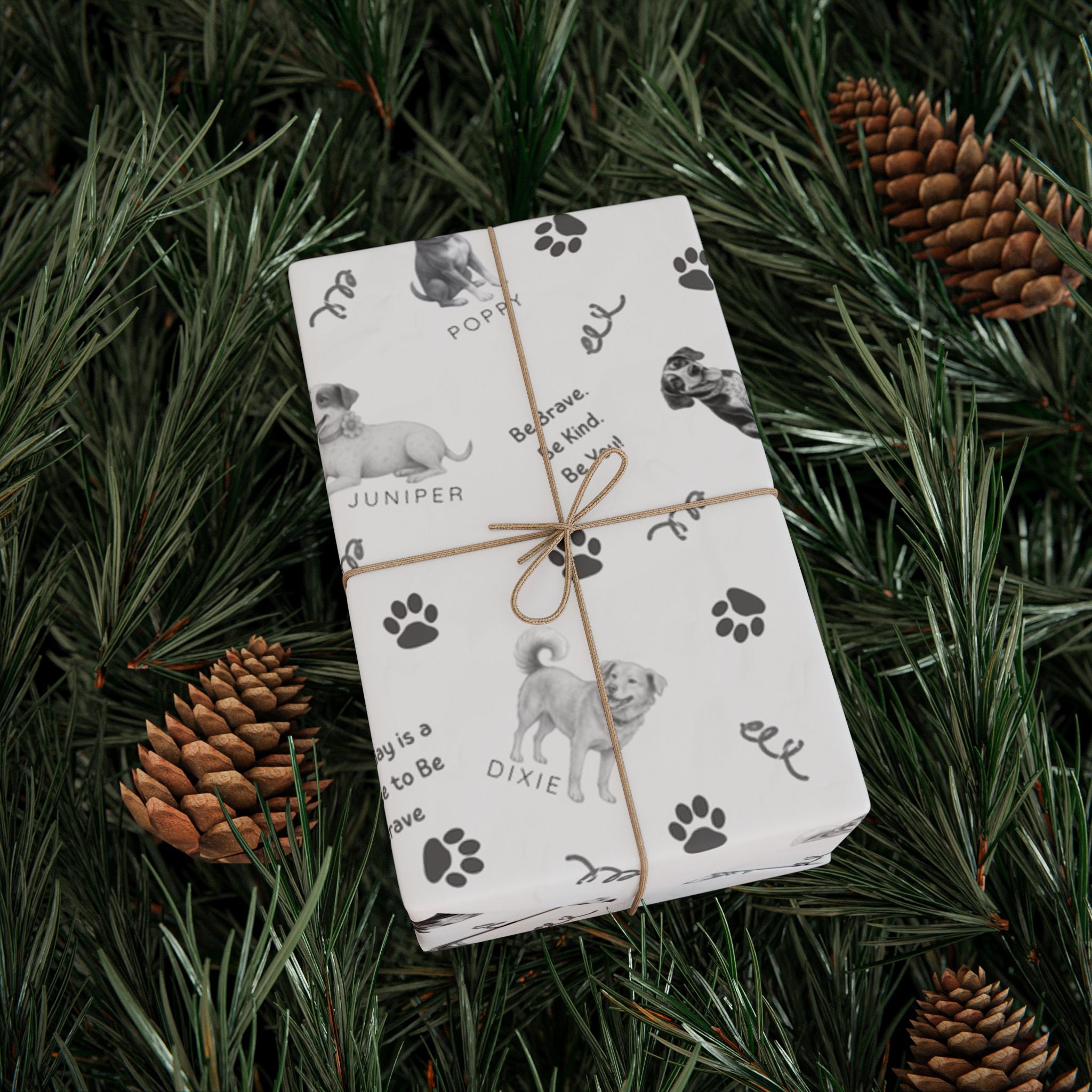 Box wrapped in The Adventures of Poppy neutral holiday wrapping paper in Christmas tree
