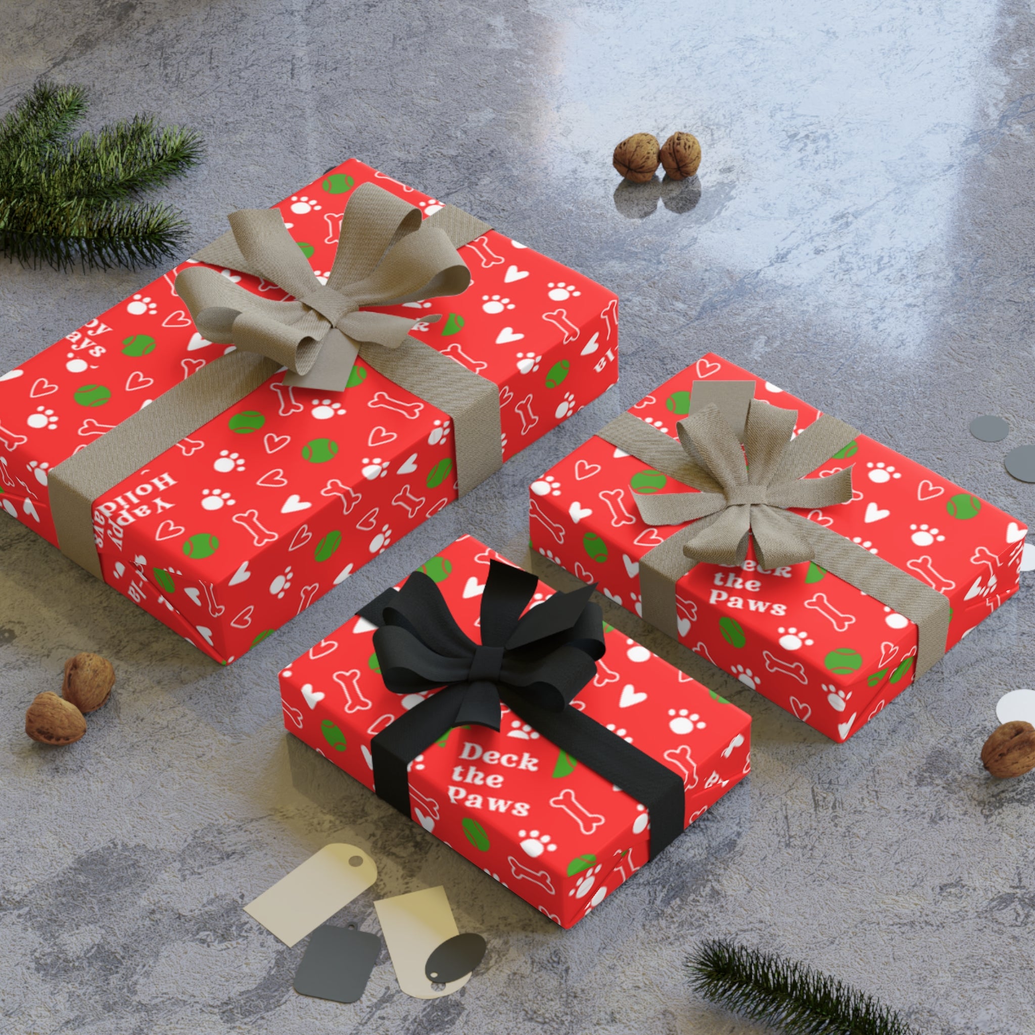 Roll of red and green Christmas dog wrapping paper with paw prints and bones pattern