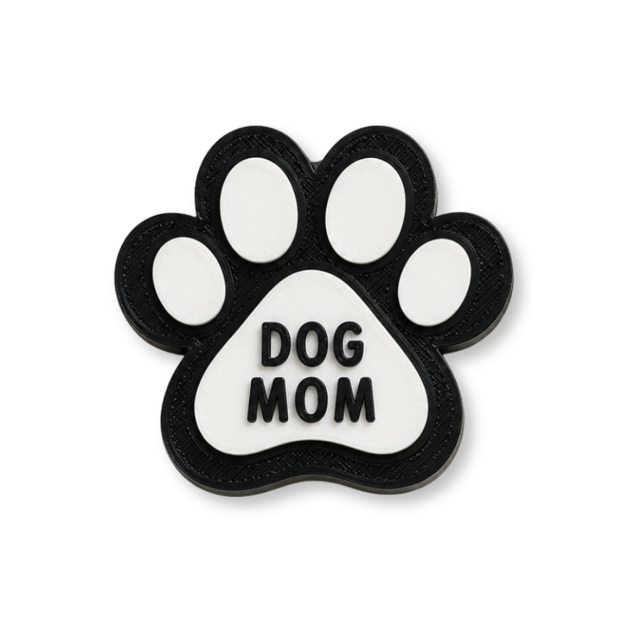 Paw-shaped decorative item with 'DOG MOM' text on a white background
