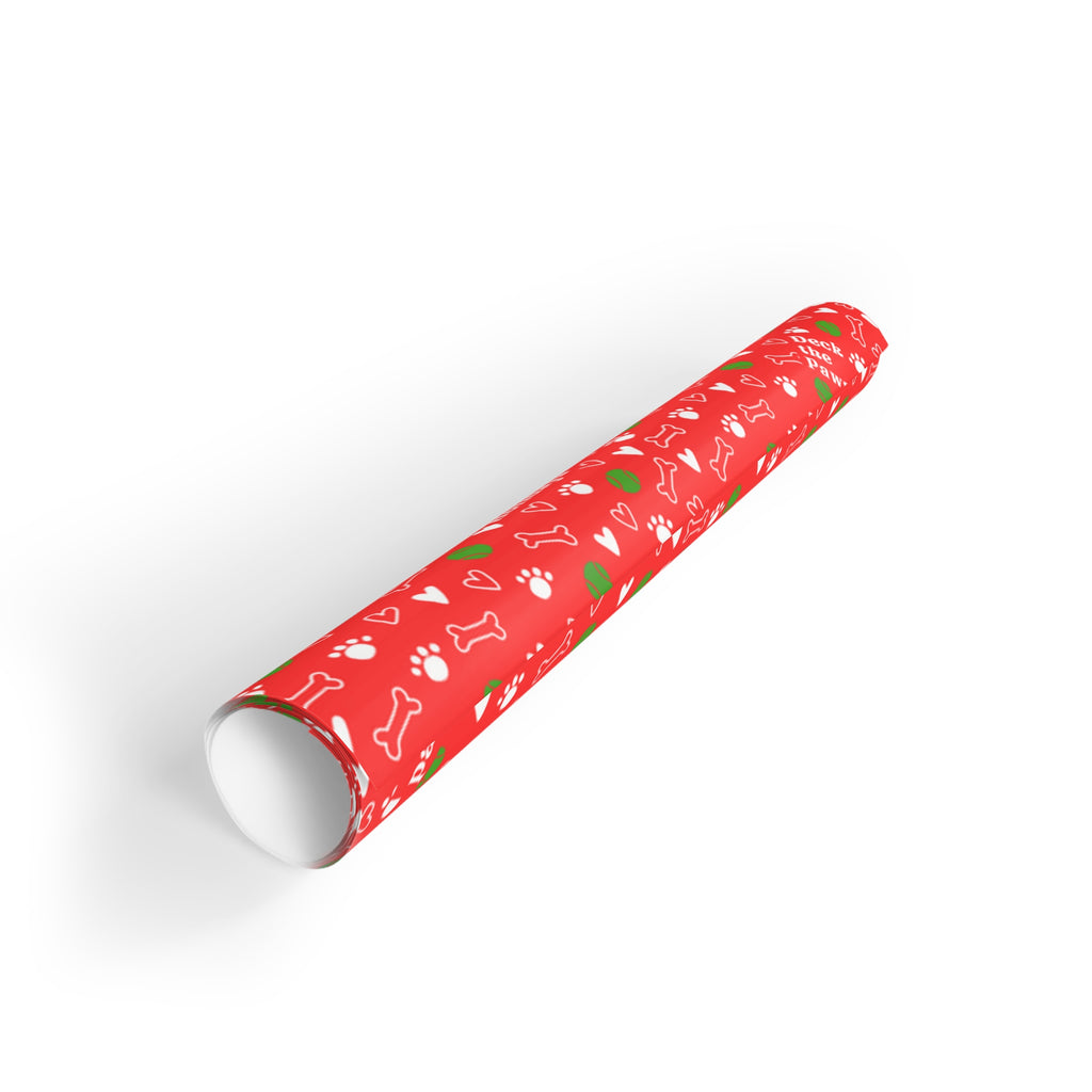 Gift wrapped in Christmas dog paper with bow, on white background