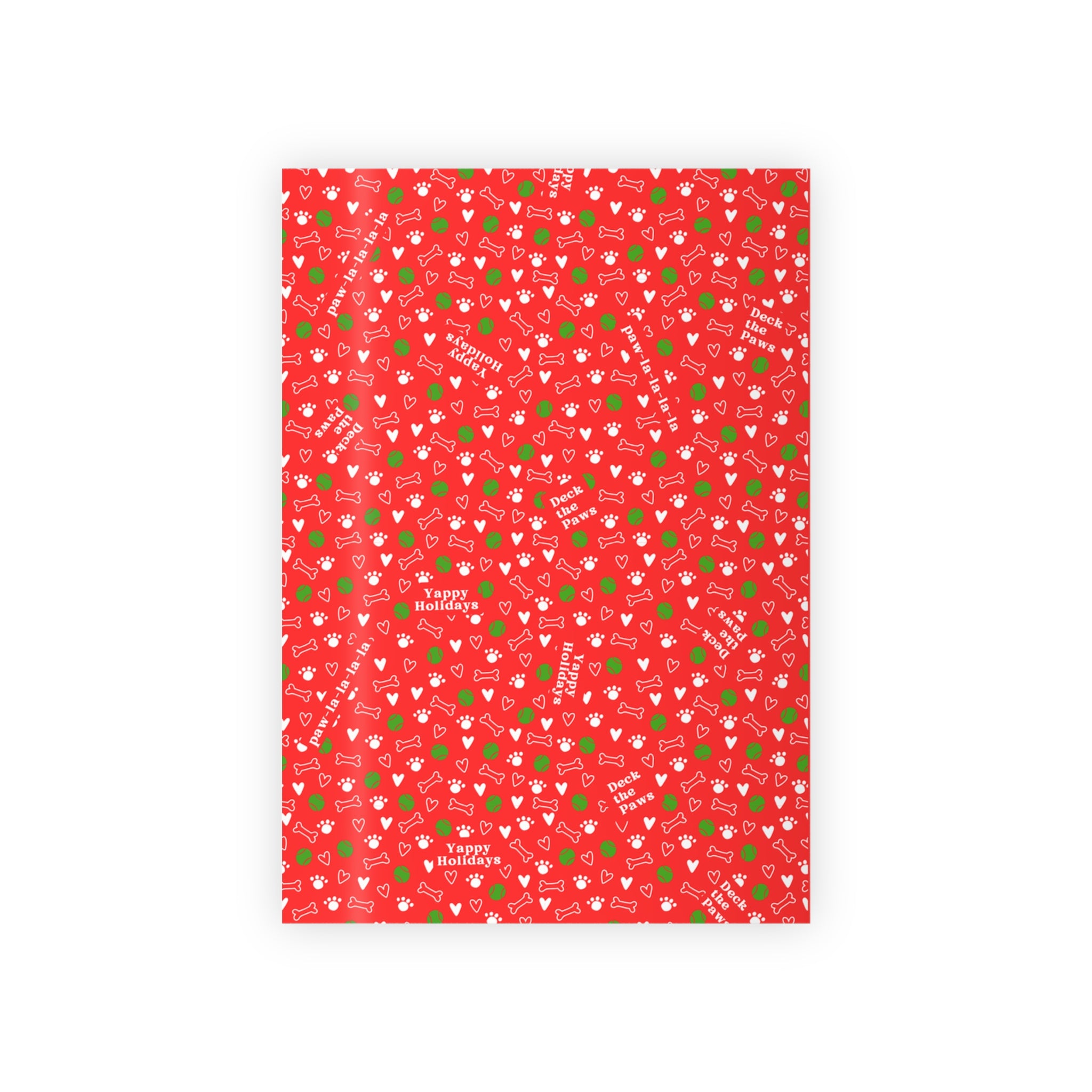 Gift wrapped in Christmas dog paper with bow, on white background