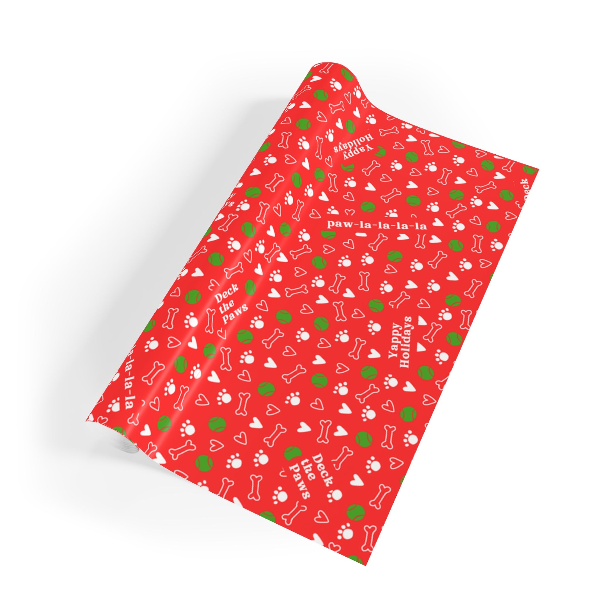 Three wrapped gifts in dog-themed Christmas paper stacked on wooden surface